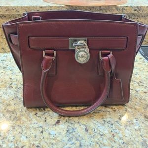 Medium wine colored Michael Kors handbag